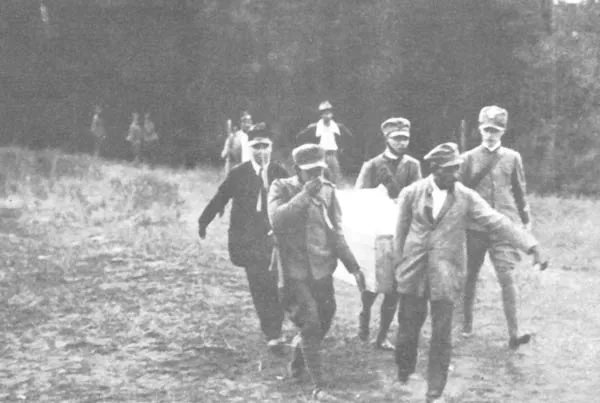 A member of Parliament who spoke against Mussolini was kidnapped and murdered in broad daylight. The picture shows the removal of the MP's body from the forest